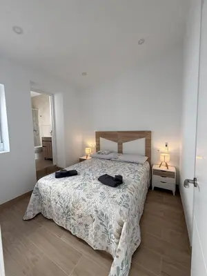 Cama o camas de una habitación en Escápate al centro de Antequera Casa con patio