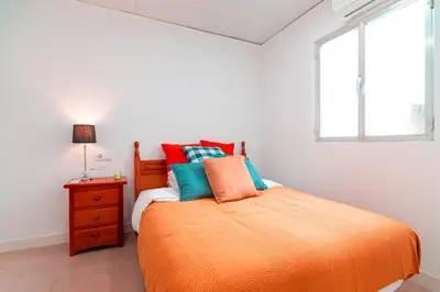 Cama o camas de una habitación en EDomus Esencia Macarena