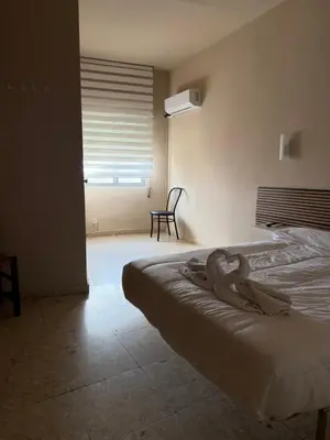 Cama o camas de una habitación en Hostal Alcántara