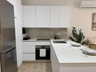 Una cocina o zona de cocina en Apartamentos Centro Suites