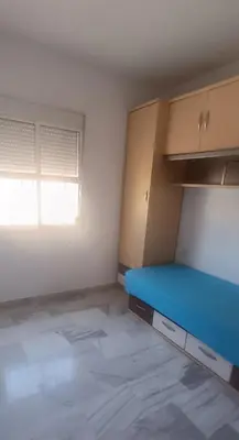 Cama o camas de una habitación en Enjoy Sevilla