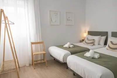 Cama o camas de una habitación en The Felipe II Apartment