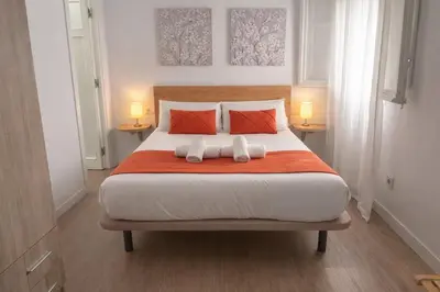 Cama o camas de una habitación en The Felipe II Apartment