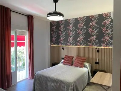 Cama o camas de una habitación en Hostal Calderón de la Barca