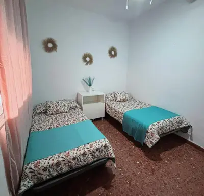 Cama o camas de una habitación en Alojamiento rural El Membrillo