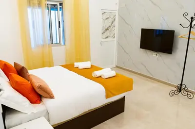 Una televisión o centro de entretenimiento en Suite San Luis