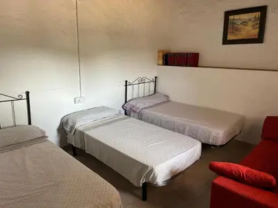 Cama o camas de una habitación en Cortijo rural la loma de los bandoleros
