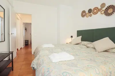 Cama o camas de una habitación en Wish Suite Bulería Sevilla