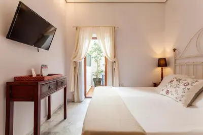 Cama o camas de una habitación en La Casa del Maestro Boutique