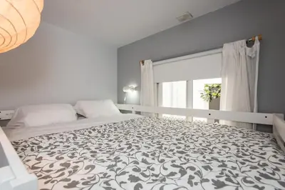 Cama o camas de una habitación en Divi Apartments Valvanera