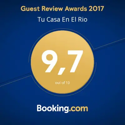 Certificado, premio, señal o documento que está expuesto en Tu Casa En El Rio