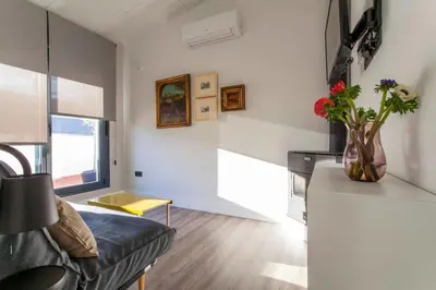 Una televisión o centro de entretenimiento en Apartamentos RG Dúplex San Bernardo