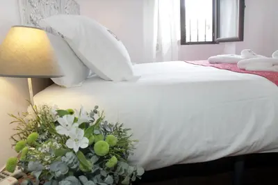 Cama o camas de una habitación en Apartamentos San Fernando 76