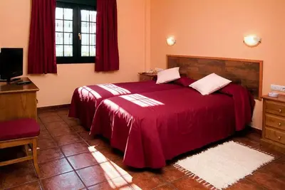 Cama o camas de una habitación en Hotel Ruta del Poniente