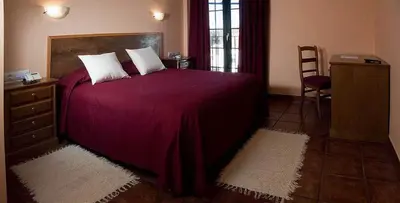 Cama o camas de una habitación en Hotel Ruta del Poniente