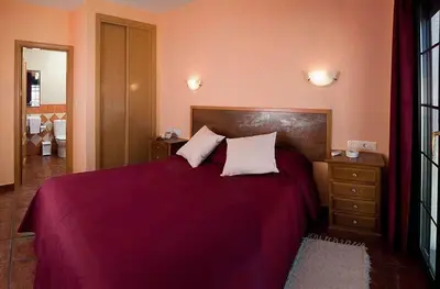 Cama o camas de una habitación en Hotel Ruta del Poniente
