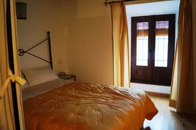 Cama o camas de una habitación en Casa de la Placeta del Rincón