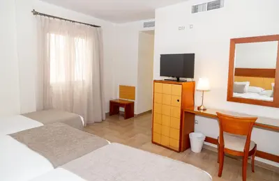 Una televisión o centro de entretenimiento en Hotel Córdoba Centro