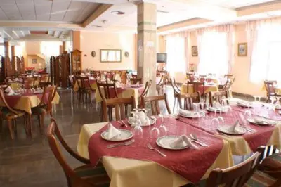 Un restaurante o sitio para comer en Escudo de Granada