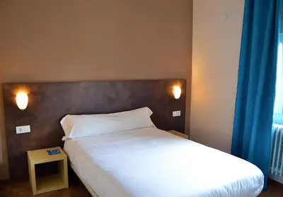 Cama o camas de una habitación en Hostal Restaurante Los Mellizos