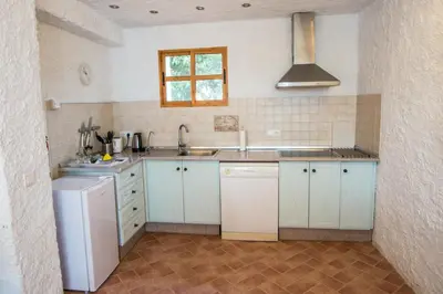 Una cocina o zona de cocina en La Finca Blanca