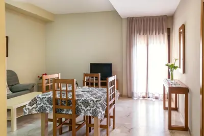 Una televisión o centro de entretenimiento en Apartamentos Turísticos La Castilleja