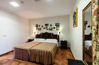 Cama o camas de una habitación en Hotel Palacio del Intendente