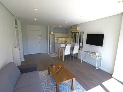 Una televisión o centro de entretenimiento en Apartamento Boulevard Gran Capitan