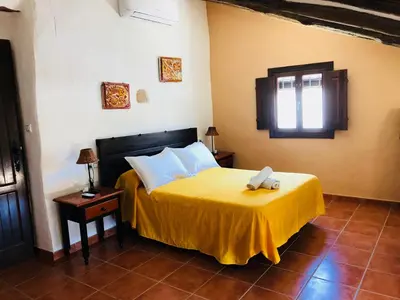 Cama o camas de una habitación en Cortijo El Horcajillo