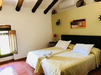 Cama o camas de una habitación en Cortijo El Horcajillo