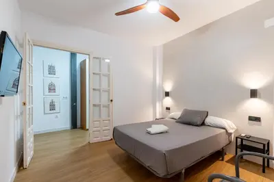 Cama o camas de una habitación en HOUSE SEVILLANA 6 habitaciones