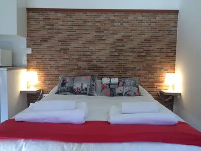 Cama o camas de una habitación en Apartamentos Gadi Corral Siglo XVI
