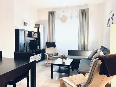 Una televisión o centro de entretenimiento en Apartamento Pintor Palomino