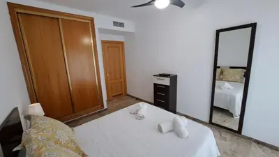 Cama o camas de una habitación en Apartamentos Maria Cristina con parking privado gratis