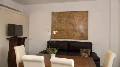 Una televisión o centro de entretenimiento en Apartamentos Turísticos Córdoba Califal