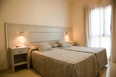 Cama o camas de una habitación en Hotel El Capricho