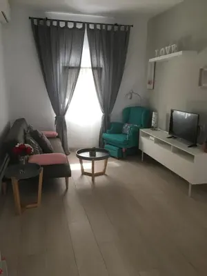 Una televisión o centro de entretenimiento en Apartamento Los Naranjos de Santa Justa