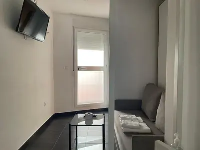 Una televisión o centro de entretenimiento en Loft Ciudad Jardín