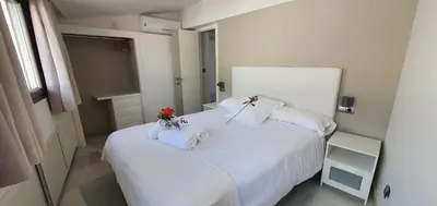 Cama o camas de una habitación en Apartamentos Torre de la Mezquita