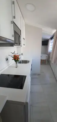 Una cocina o zona de cocina en Apartamentos Torre de la Mezquita