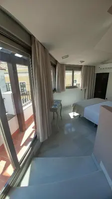Cama o camas de una habitación en Apartamentos Torre de la Mezquita