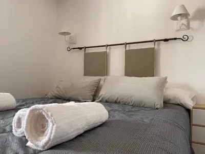 Cama o camas de una habitación en Casa Vacacional Alcazabilla