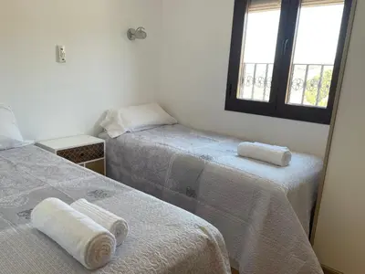 Cama o camas de una habitación en Casa Vacacional Alcazabilla