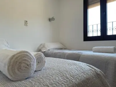 Cama o camas de una habitación en Casa Vacacional Alcazabilla