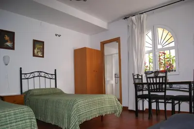 Cama o camas de una habitación en Hostal Alcazar I