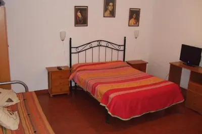 Cama o camas de una habitación en Hostal Alcazar I