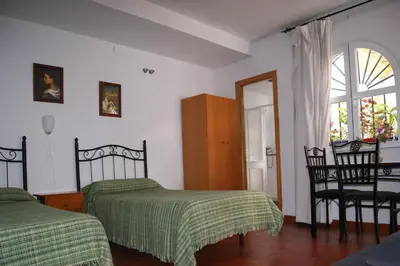 Cama o camas de una habitación en Hostal Alcazar I