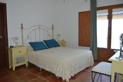Cama o camas de una habitación en El Olivo del Moreno