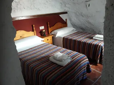 Cama o camas de una habitación en Casa Rural Cueva El Sauce