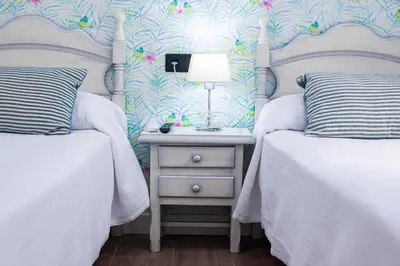 Cama o camas de una habitación en Hostal San Francisco